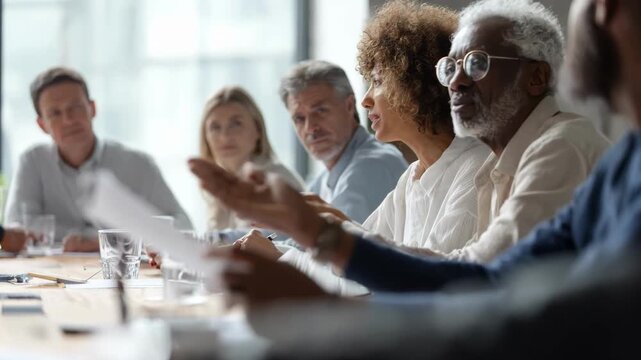 Mid shot of diverse experts reviewing ethical grantmaking policy documents in a bright conference room emphasizing responsible funding principles and collaborative decisionmaking.