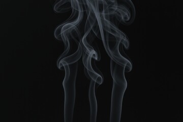 Obraz premium Abstract Smoke Plumes Flowing Gracefully Against a Dark Backdrop Creating an Ethereal Visual