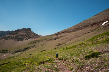 Fototapeta premium Backpacker Heading Up To Red Gap Pass In Glacier