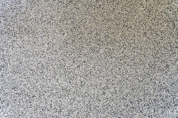 Seamless speckled granite texture background with natural stone pattern in neutral tones, ideal for design and surface mockups