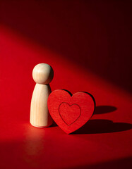 Self Love and Mental Health Concept with Wooden Figure and Heart
