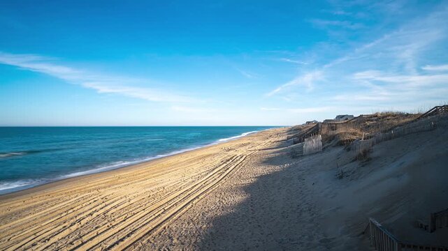 Kill Devil Hills, North Carolina, a long exposure time lapse at sunset featuring the Atlantic Ocean coastline, sandy beaches, and moving waves on the Outer Banks.