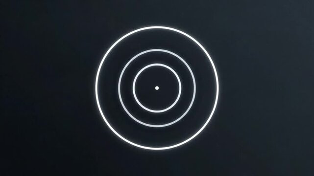 Glowing white concentric circles with a small dot at the center against a dark background with a white border at the bottom.