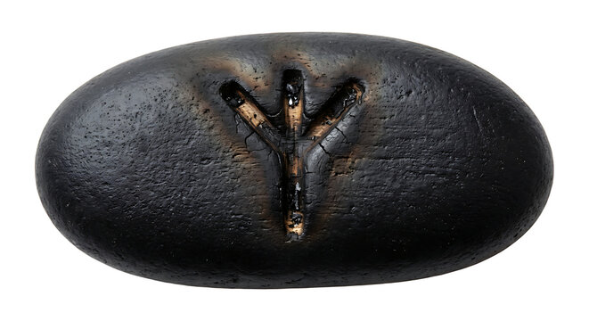 Black Stone with Carved Rune Symbol. Ancient Mystical Object.