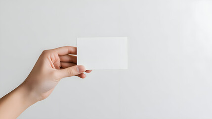 hand holding blank business card