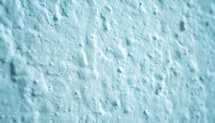 Light Blue Textured Wall Background with Rough Stucco Finish. Abstract Close-up Surface Detail for Graphic Design and Interior Decoration Concepts. © Adrian Syauqi