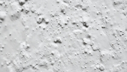 Macro View of Rough White Texture Background. Abstract Bumpy Wall Surface Finished with Thick, Irregular Stucco Paint or Plaster. © Adrian Syauqi