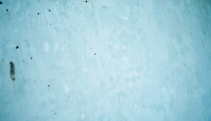 Obraz premium Abstract Light Blue Texture Background. Vibrant Pastel Aqua Surface with Subtle Gritty Details and Dust Speckles. Copy Space Template for Design and Wallpaper.