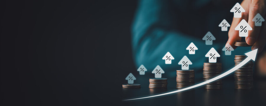 Stacked coins with rising percent house icons and upward arrow symbolizing higher interest rates mortgage costs inflation and smart investment growth in digital finance era