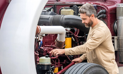 Semi trucks vehicle. Hispanic man trucker. Handsome man driver in front of truck. Trucking owner....