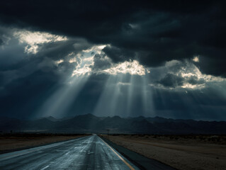 Dark storm cloud sunbeam empty desert highway dramatic sky mountain silhouette moody light stormy weather ray of light
