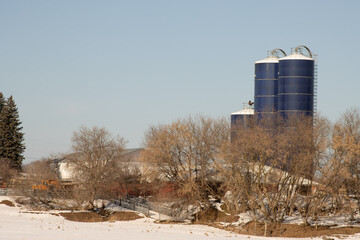 grain silos with snow during wintertime © Brian