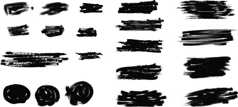 Collection of black brush strokes and smudges on a white background
