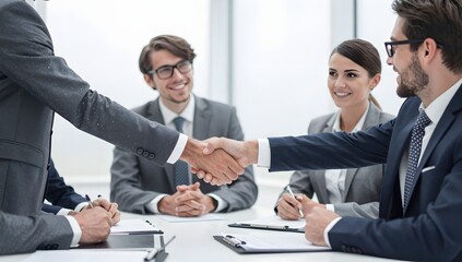 Fototapeta premium Business people shaking hands during a meeting to close a deal together