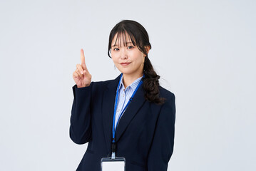 指を立てるポーズをするビジネスウーマン