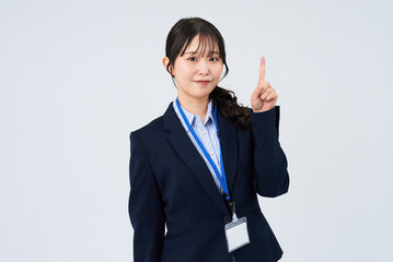 指を立てるポーズをするビジネスウーマン