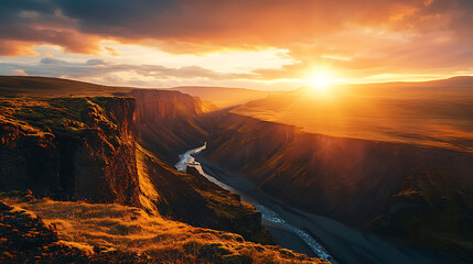 Fototapeta premium Majestic sunset over rugged canyon landscape with winding river.