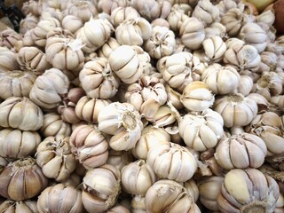 Pile of Fresh Garlic Bulbs Ready for Cooking.