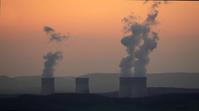 Cattenom Nuclear Power Plant station smoke smog cooling vapor time lapse France, sunset