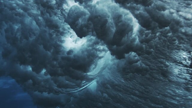 Textured underwater wave surface with shimmering highlights and layered blue water patterns