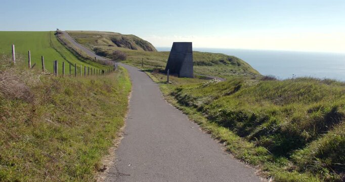 Extra wide panning shot looking down the north downs way onto abbot's Cliff sound mirror