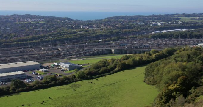 Wide panning shot looking down on to the Channel tunnel, Eurotunnel Terminal Building at Folkestone UK