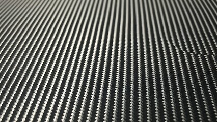 Close up view of black woven carbon fiber texture