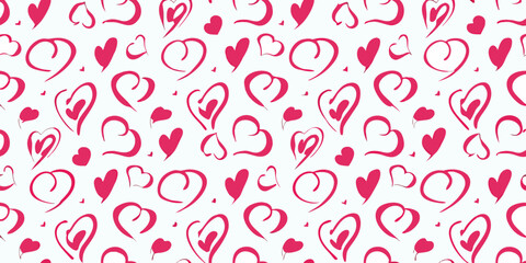 Pink hand drawn hearts and dots scattered across a white background in a seamless pattern