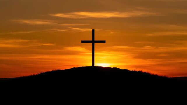 Silhouette of a single cross on a hill at sunrise. Christian symbol of hope and resurrection