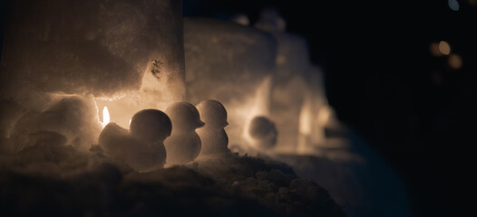 アイスキャンドルと雪のひよこ Snow baby chick and Ice candle glowing in winter night © tori