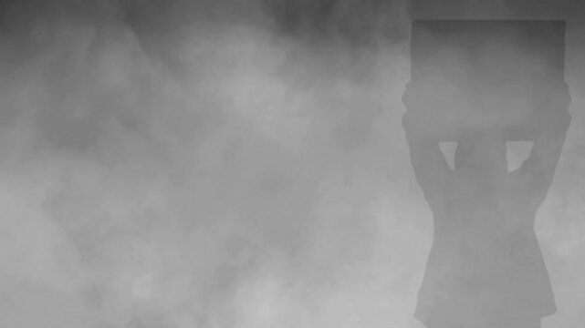 Man silhouette on white smoke
