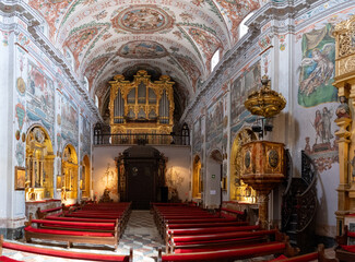 Obraz premium Sevilla, Spain - 4 Sep 23: Pipe organ and nave interior at Hospital de los Venerables, Seville