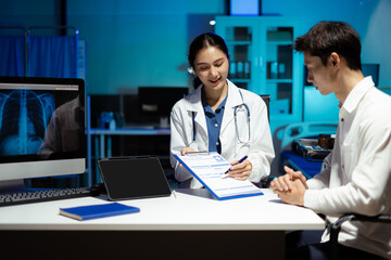 Fototapeta premium female therapist consulting male patient about pills. Doctor prescribing medicine sitting at the desk in the Hospital.