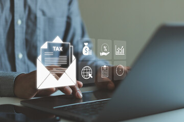 Businessman using laptop with digital tax document in email, online payment icons and financial report interface. Concept of e-filing, tax return, accounting, fintech and business finance technology.