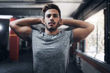 Fototapeta premium Stretching, fitness and man in gym for health, wellness and workout preparation for practice. Warm up muscle, sports club and person getting ready for exercise, training and scapular retraction