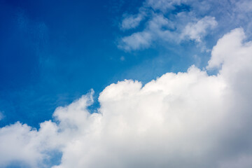 Obraz premium Bright Blue Sky with Large White Clouds Background