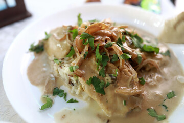 Creamy mushroom chicken with rice and fresh parsley