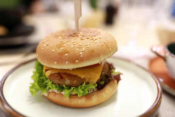 Delicious cheeseburger with fresh lettuce