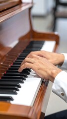 A close-up of hands playing piano keys