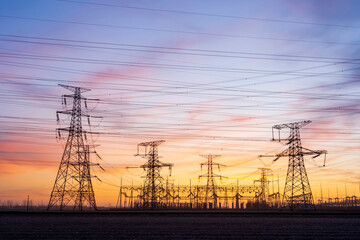 The pylons are in the evening, Substation in the evening, High voltage substation and beautiful sunset glow