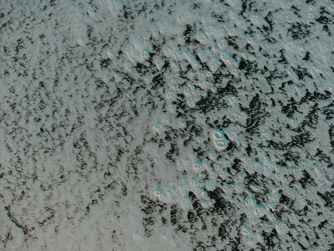 Drone captures frozen ice patterns on water in Michigan