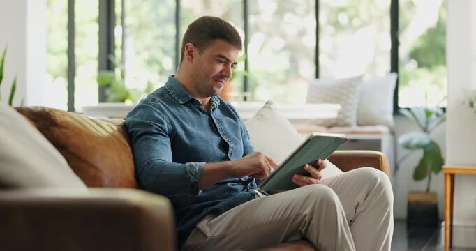 Happy, freelancer and man with tablet, lounge and copywriting on social media, scroll or ad campaign. Online, copywriter and person with tech for remote work, research and email marketing in house