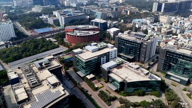 Drone shot over TCS Deccan Park&mdash;where Hyderabad&rsquo;s IT energy converges, framed by elevated metro tracks, business hubs, and fast-growing skylines.