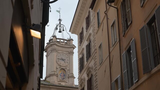 The concave brick facade and ornate ironwork of the Borromini designed clock tower located at the Piazza dell Orologio in the historic center of Rome