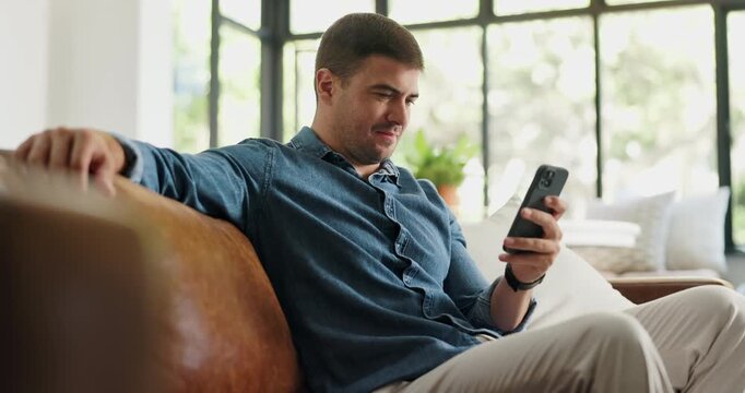 Smile, man and relax with phone at house for social media, browsing website and online news. Happy, male person and mobile for reading ebook, download games and message notification for weekend break