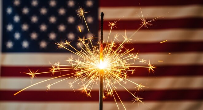 Sparkler in front of american flag on independence day