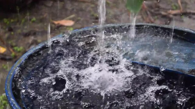 heavy rain fell in a full water tank