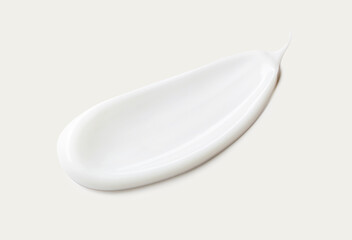 cosmetic smear of creamy texture on gray background