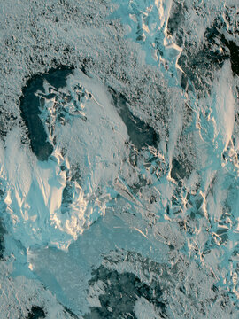 Drone view of frozen ice chunks and winter landscape in Michigan