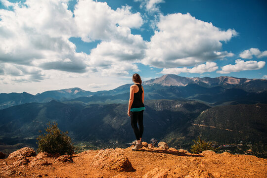 Woman Standing of Edge of Mountain Looking Out